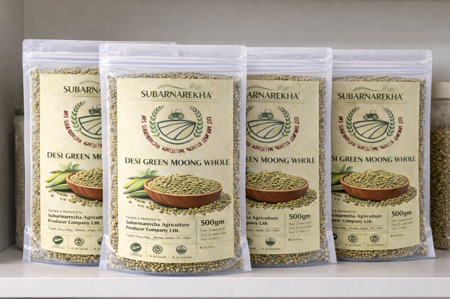 Four packages of Subarnarekha Desi Green Moong Whole on a shelf.