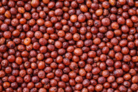 Close-up of red lentils with a textured pattern