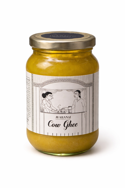 Jar of Desi cow ghee with a decorative label on a white background
