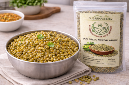 Bowl of green lentils next to a package of Subarnarekha Desi Green Moong Whole on a table.