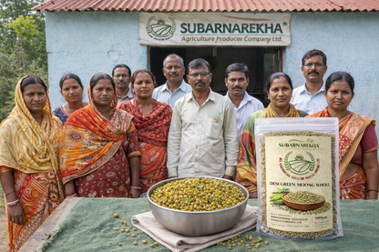 Group of people with a Subarnarekha product and green peas on a table outdoors.