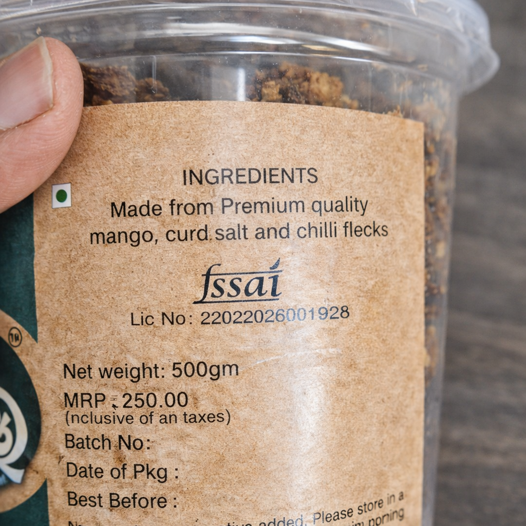 Container with a label detailing ingredients, brand, and packaging information.