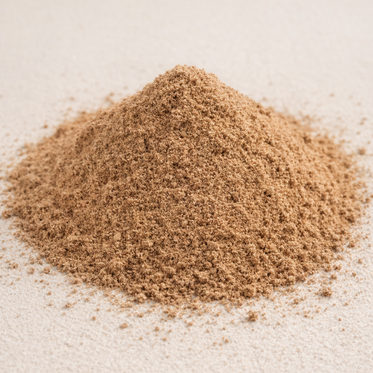 Pile of brown sand on a light beige background