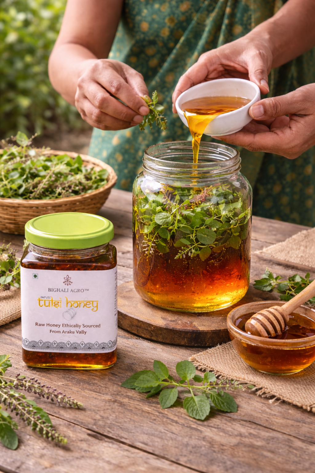 Honey being poured from a small bowl into a jar with herbs, surrounded by honey and herbs on a wooden surface.