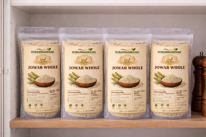 Four packages of Subarnarekha Jowar Whole on a shelf.