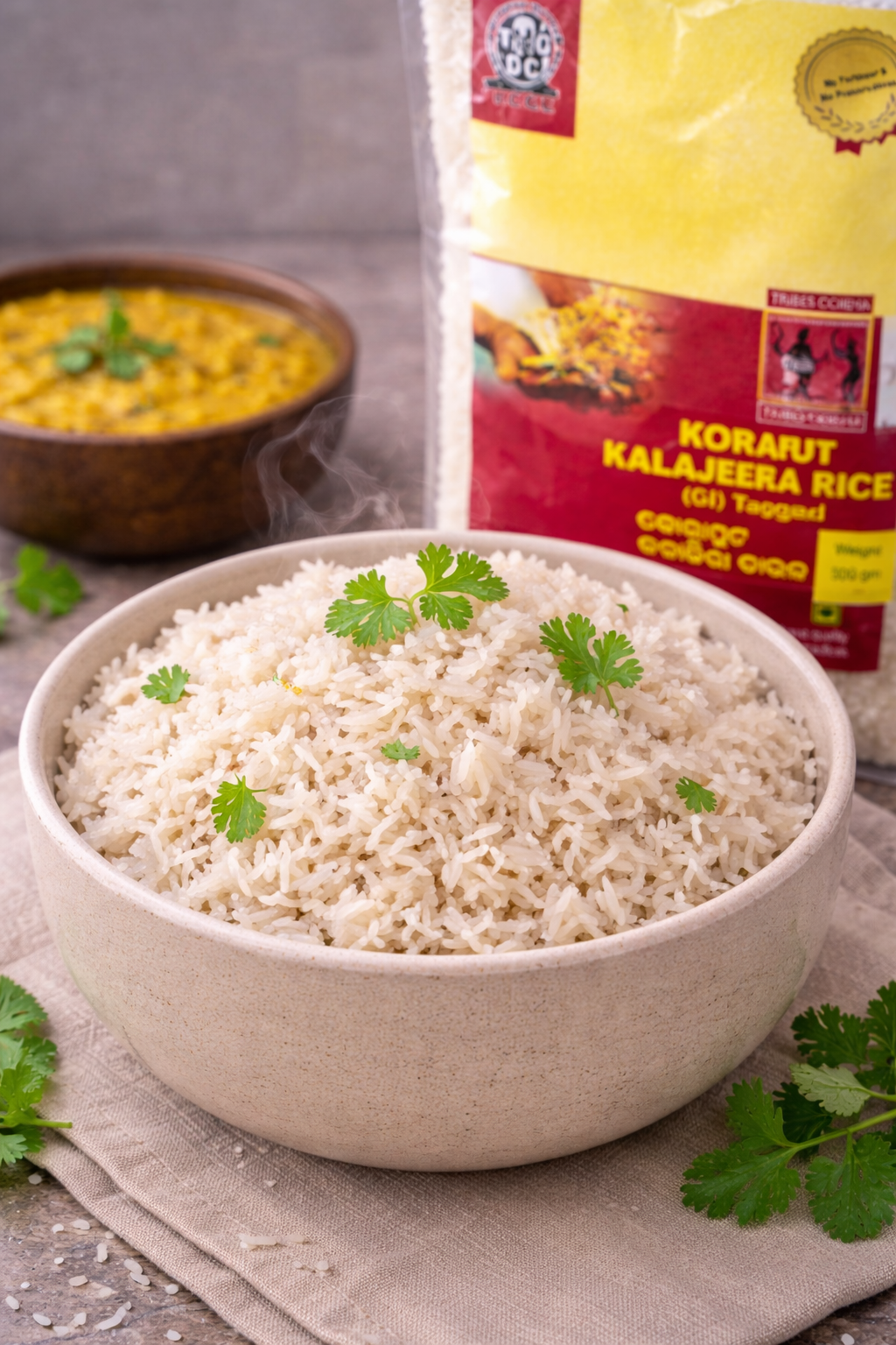 Bowl of rice with a package of Korarut Kalajeera Rice in the background.