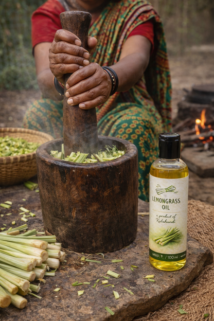 Person using a mortar and pestle with lemongrass, next to a bottle of lemongrass oil.