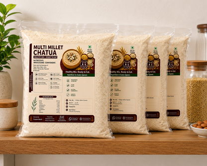 Three packages of Multi Millet Chatura on a wooden shelf with a plant and jars in the background.