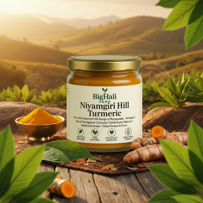 Jar of Niyangiri Hill Turmeric with turmeric roots and leaves on a wooden surface with a scenic background.