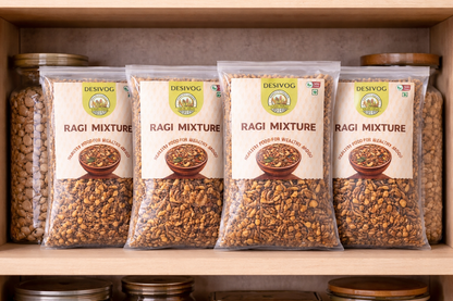 Four packages of DESIVOG Ragi Mixture on a wooden shelf.