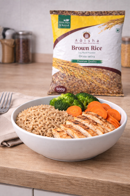 Bowl of brown rice with chicken and vegetables next to a bag of Adisha Brown Rice.