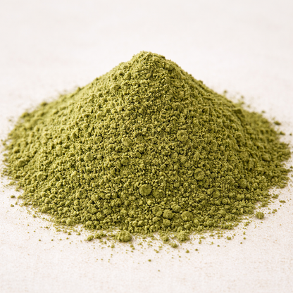 Pile of green powder on a white background