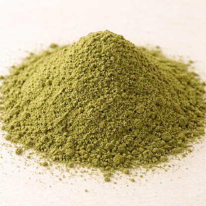 Pile of green powder on a white background
