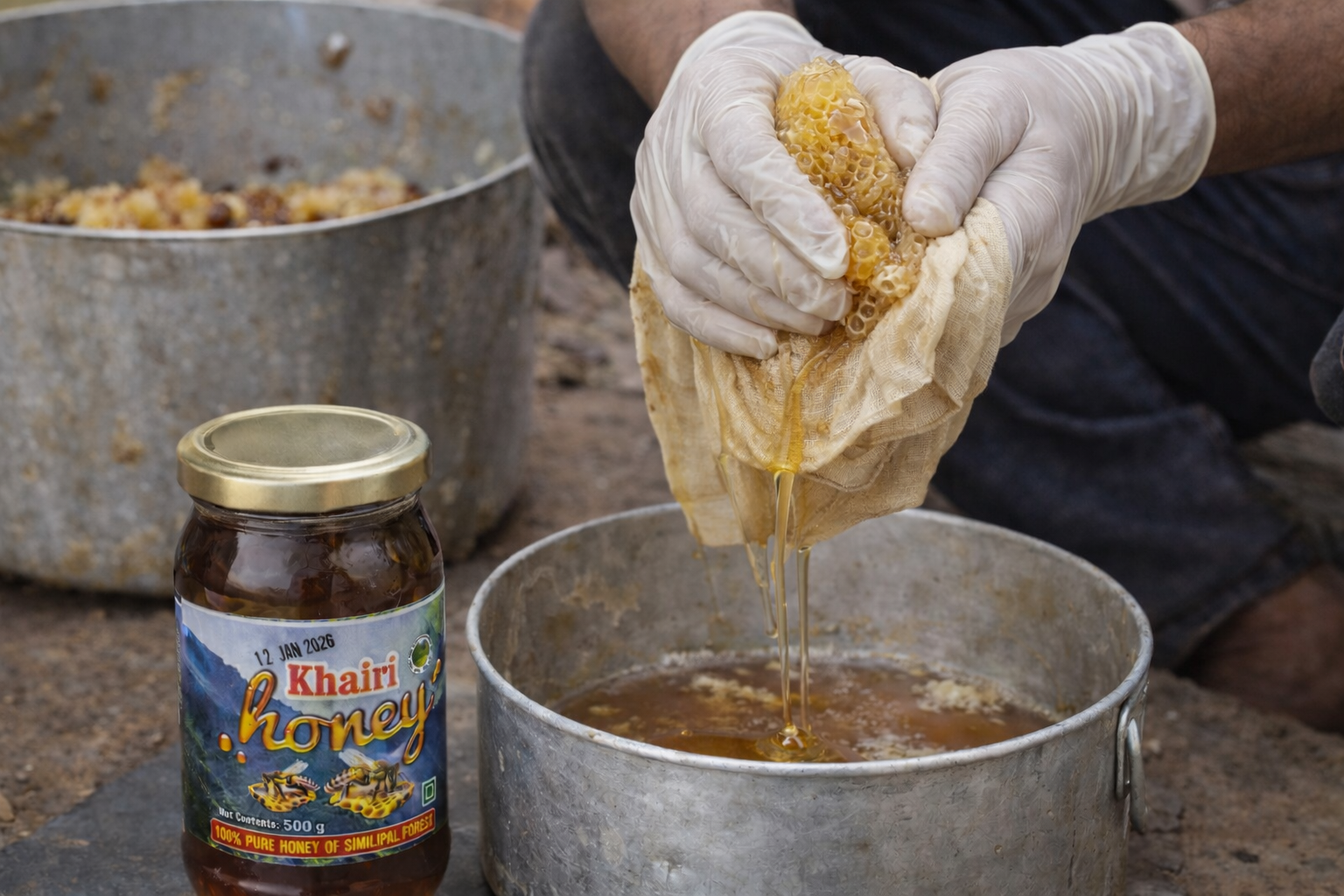 Person extracting honey from a beekeeping tool into a pot with a jar of Khairi honey nearby.