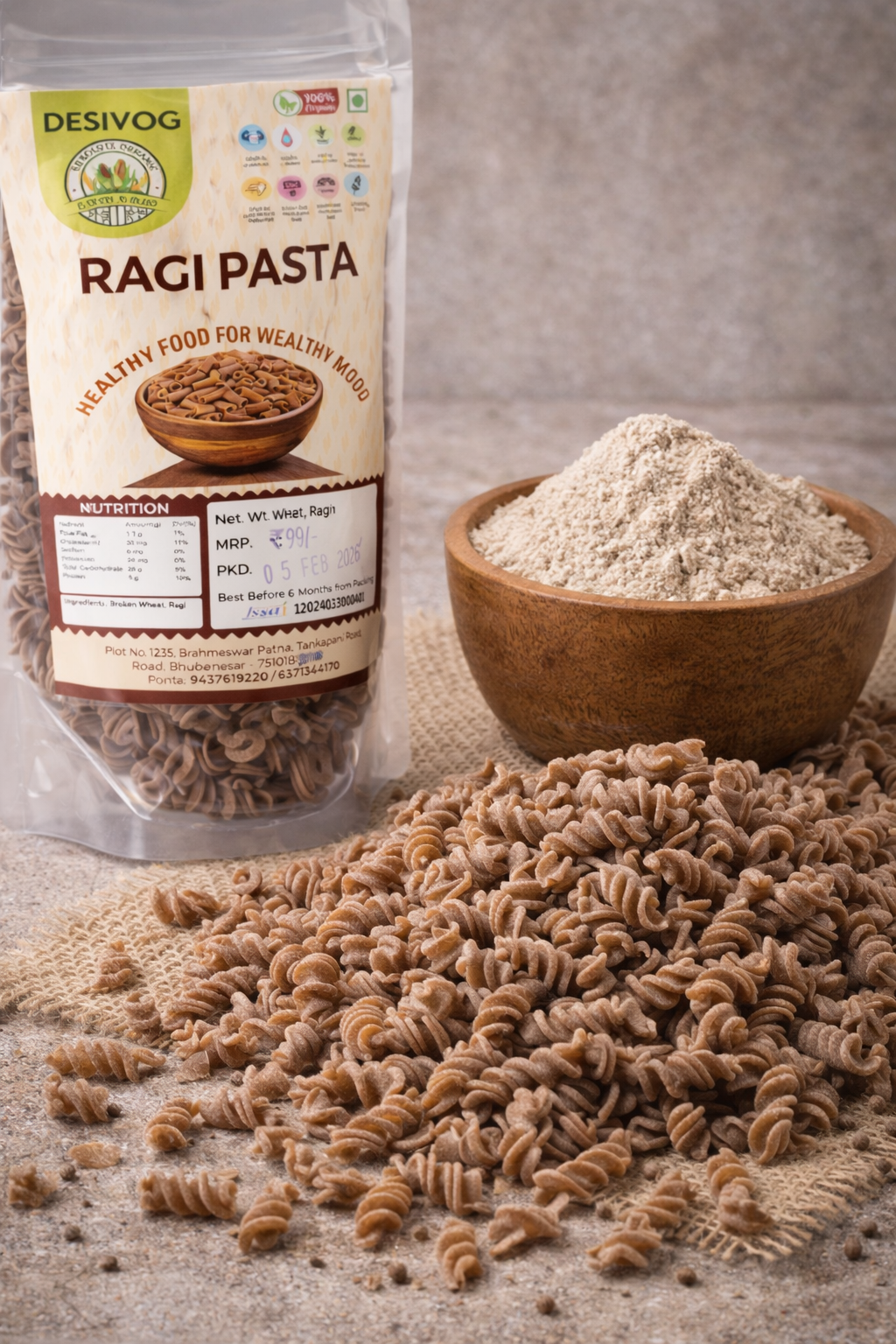 Desivog Ragi Pasta packaging with pasta and flour on a textured surface