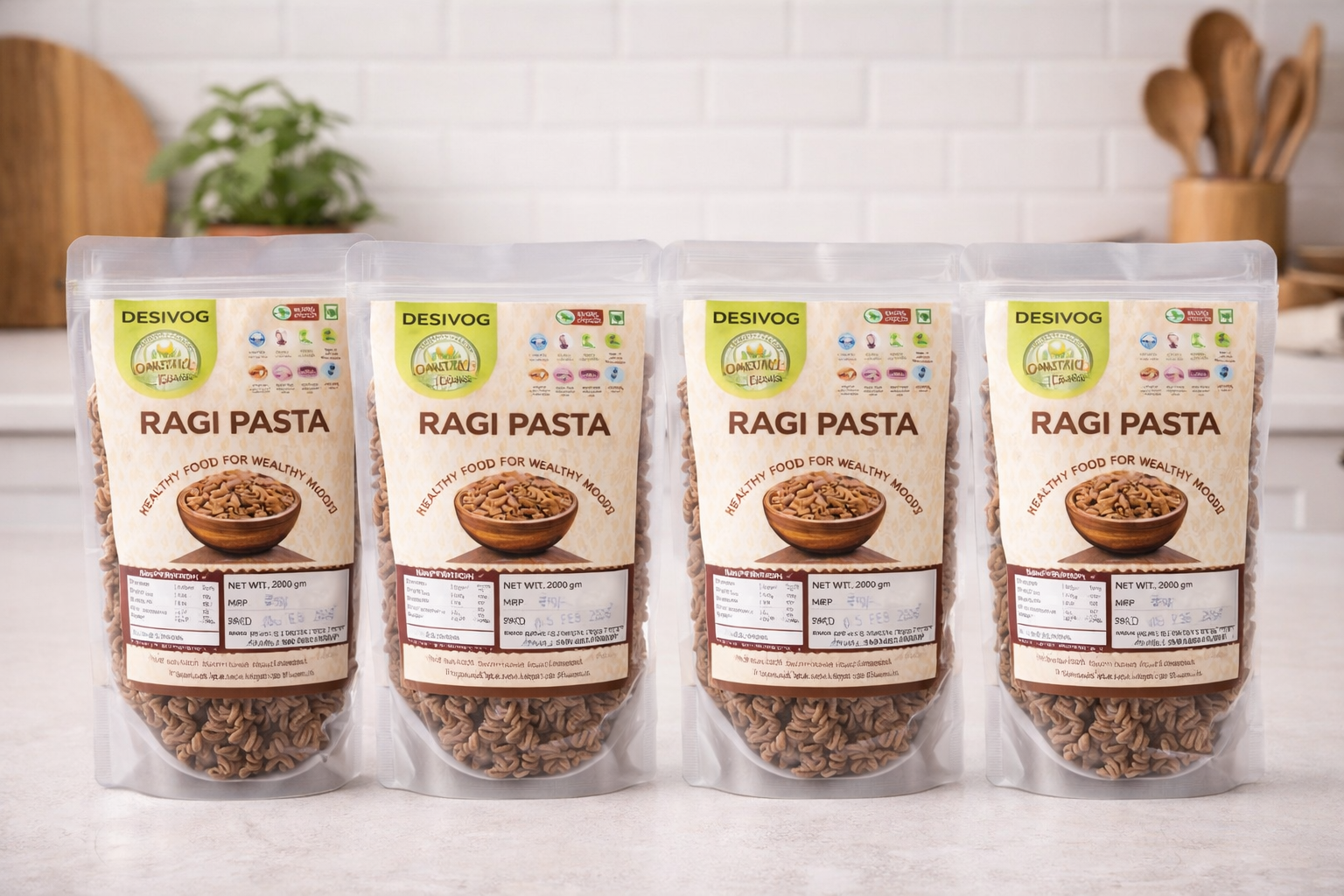 Four packages of Desivog Ragi Pasta on a kitchen counter with a white tiled wall background.
