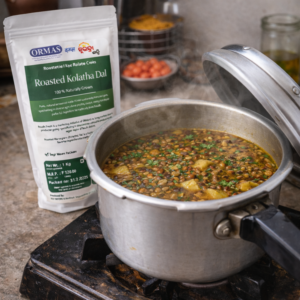 Pot of food on a stove with a package of Ormas Roasted Kolatha Dal next to it.